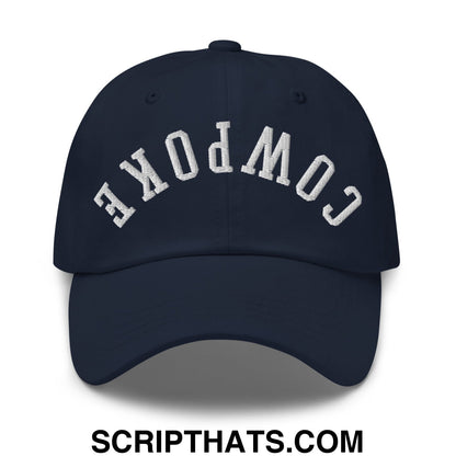 Navy blue unstructured dad hat with white embroidered cowpoke lettering in an arched design