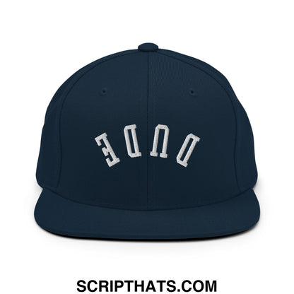 Navy blue snapback cap with white embroidered duke lettering and flat bill brim from Upside Down Dude collection