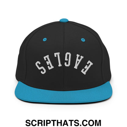 Black snapback cap with teal flat bill brim and white embroidered eagles logo on the front panel