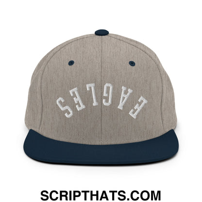 A gray and navy blue flat bill brim snapback hat with white eagles embroidered on the front
