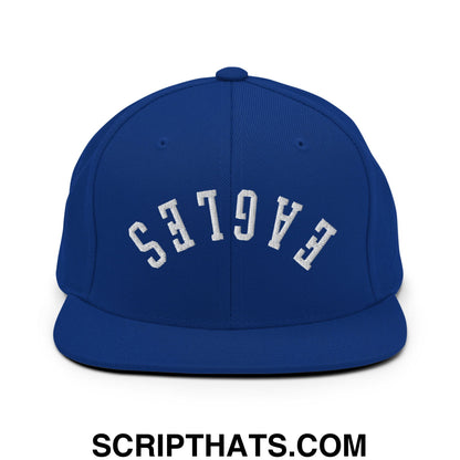 Royal blue snapback hat with flat bill brim and white embroidered eagles lettering in an arched design