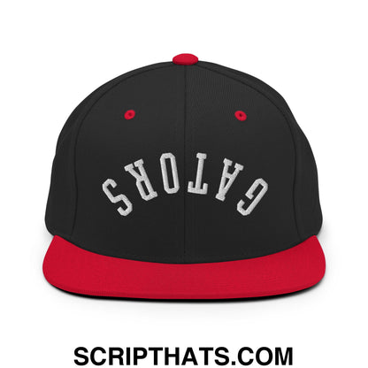 Black and red snapback cap with gators embroidered in white arched lettering on front flat bill brim