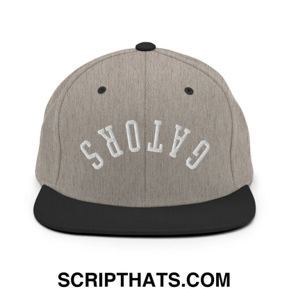 Gray and black snapback cap with white embroidered gators in arched lettering and flat bill brim