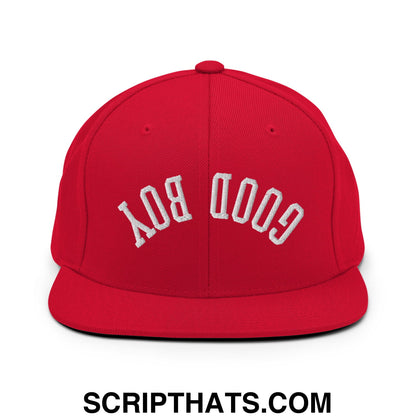 Red snapback cap with white embroidered good boy lettering in an arched design and flat bill brim