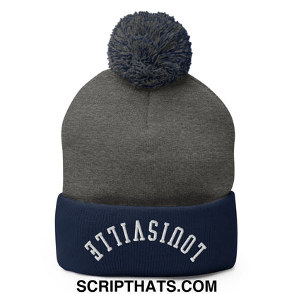Gray and navy blue knit beanie with matching pom pom and white embroidered louisville on cuff named upside down louisville pom pom beanie