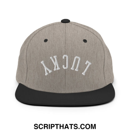Gray and black snapback cap with white embroidered lucky lettering and flat bill brim in upside down style