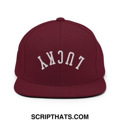 Maroon snapback hat with white embroidered lucky lettering and flat bill brim for stylish casual wear