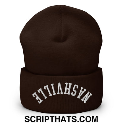 A dark brown knit beanie with white nashville embroidery on the cuff called upside down nashville embroidered cuffed knit beanie