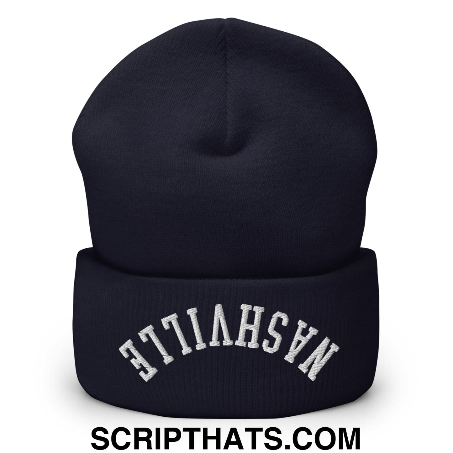 A navy blue knit beanie with nashville embroidered in white on the folded cuff upsidedown style