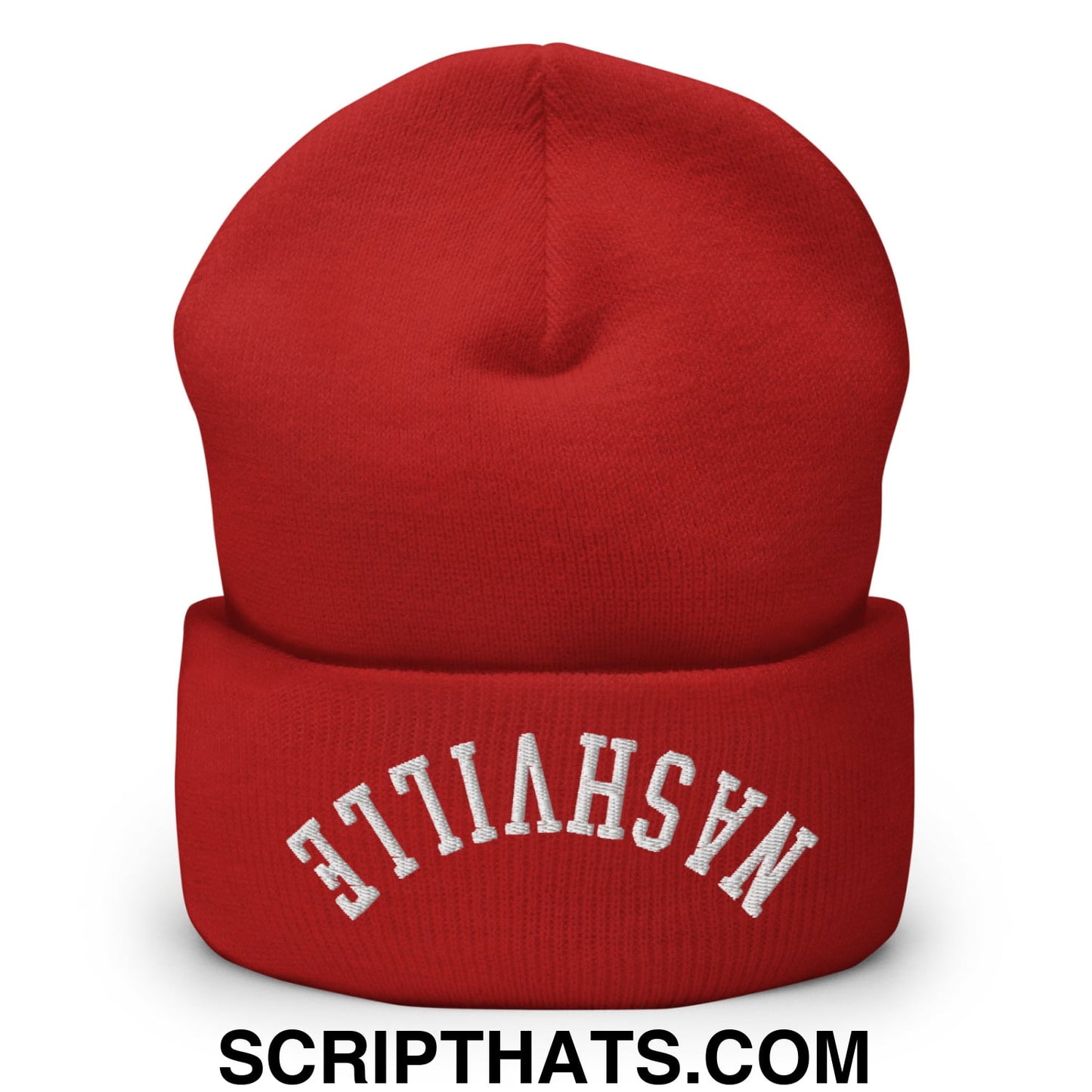 A vibrant red knit beanie with a folded cuff embroidered with nashville in white arched lettering