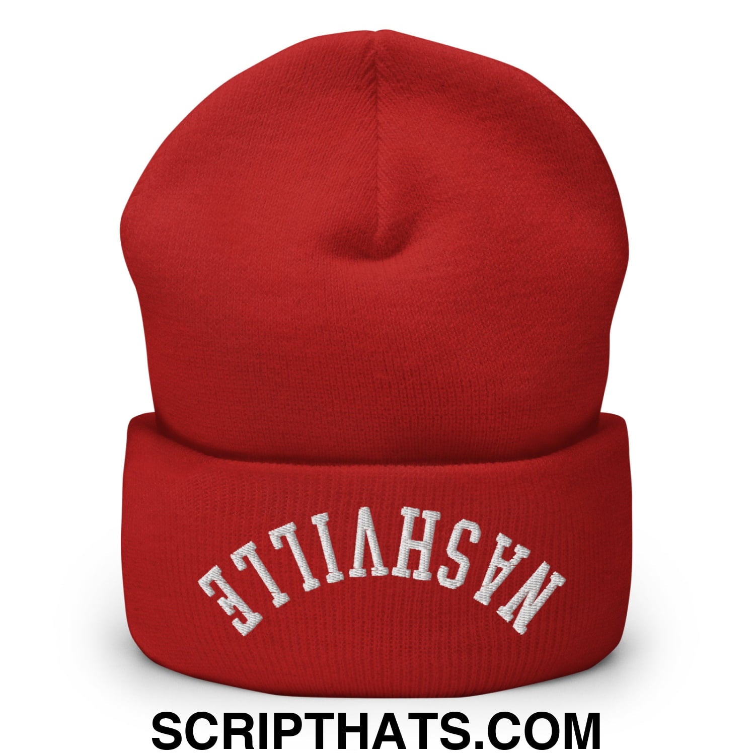 A vibrant red knit beanie with a folded cuff embroidered with nashville in white arched lettering