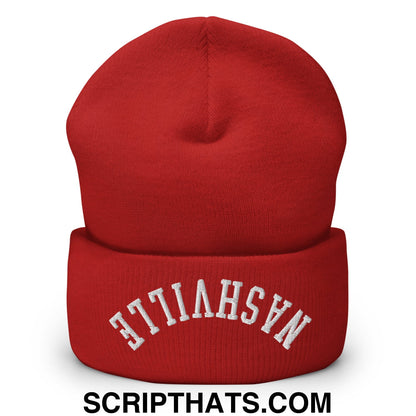 A vibrant red knit beanie with a folded cuff embroidered with nashville in white arched lettering