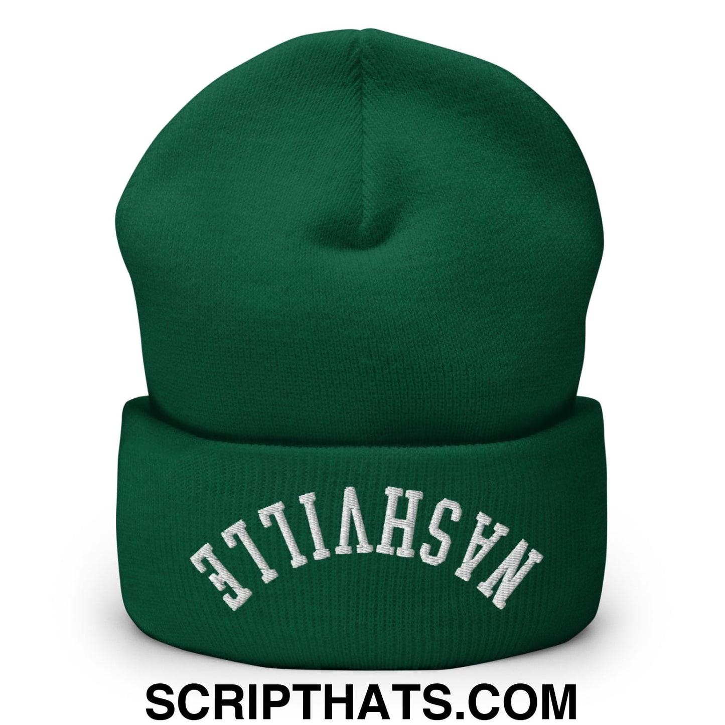 A dark green knit cuffed beanie with a folded cuff and white embroidered nashville text on the front