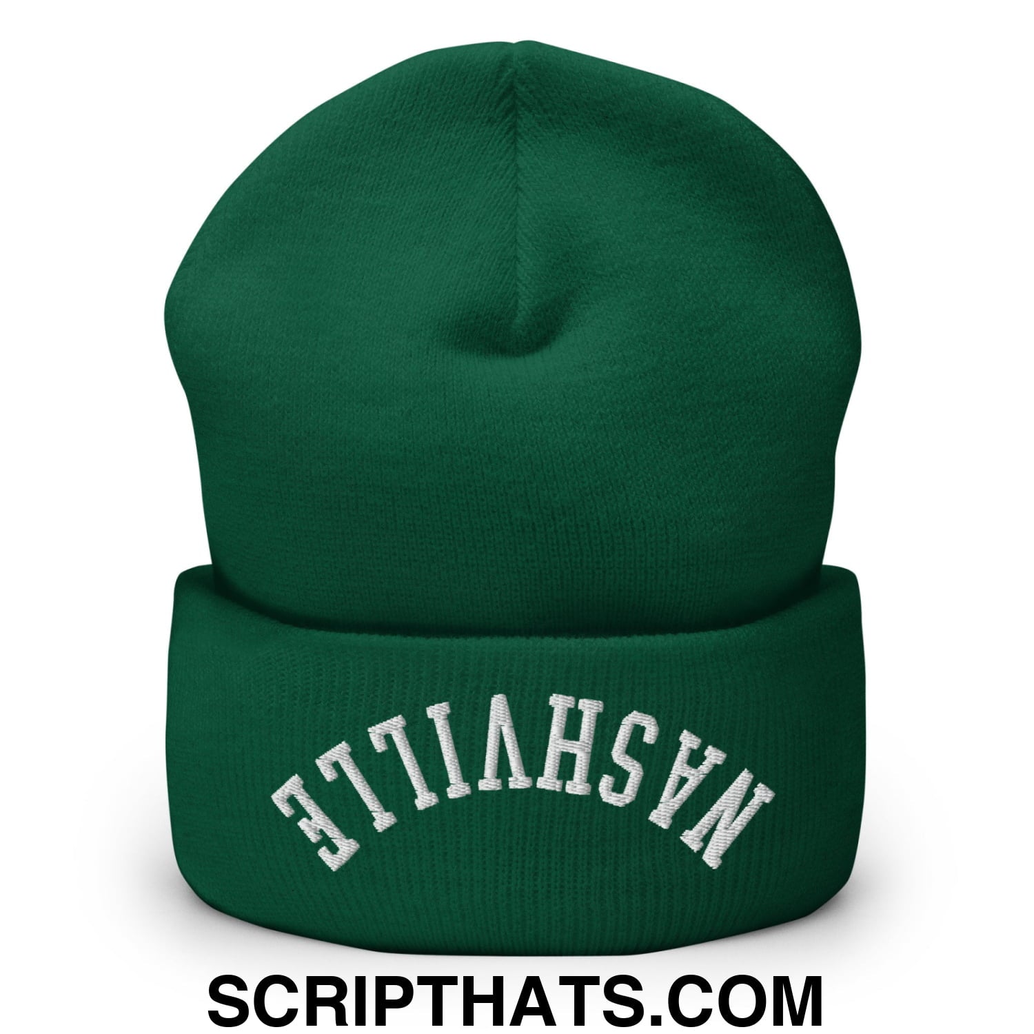A dark green knit cuffed beanie with a folded cuff and white embroidered nashville text on the front