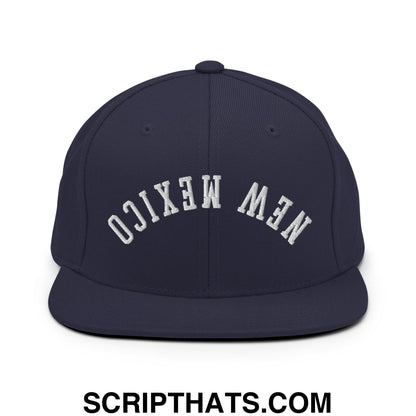 Navy blue snapback hat with white embroidered new mexico lettering and flat bill brim in an upside down style