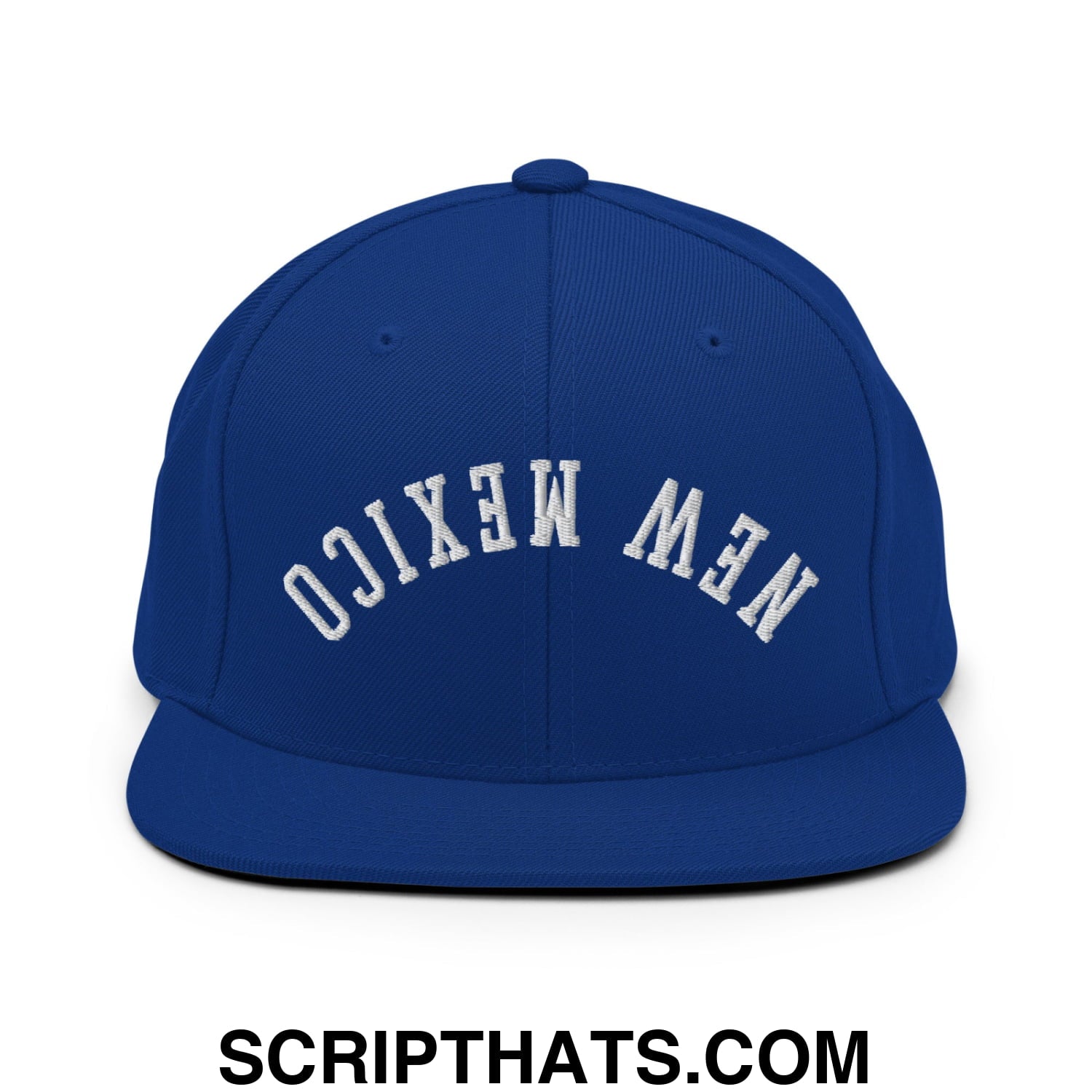 Royal blue snapback hat with white embroidered new mexico lettering in an arched design and flat bill brim