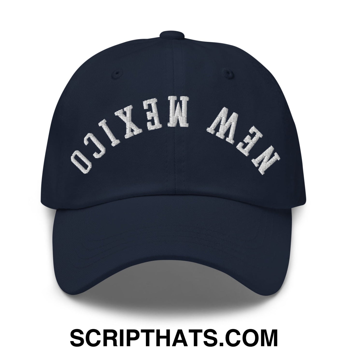 A navy blue unstructured dad hat with new mexico embroidered in white arched lettering on the front