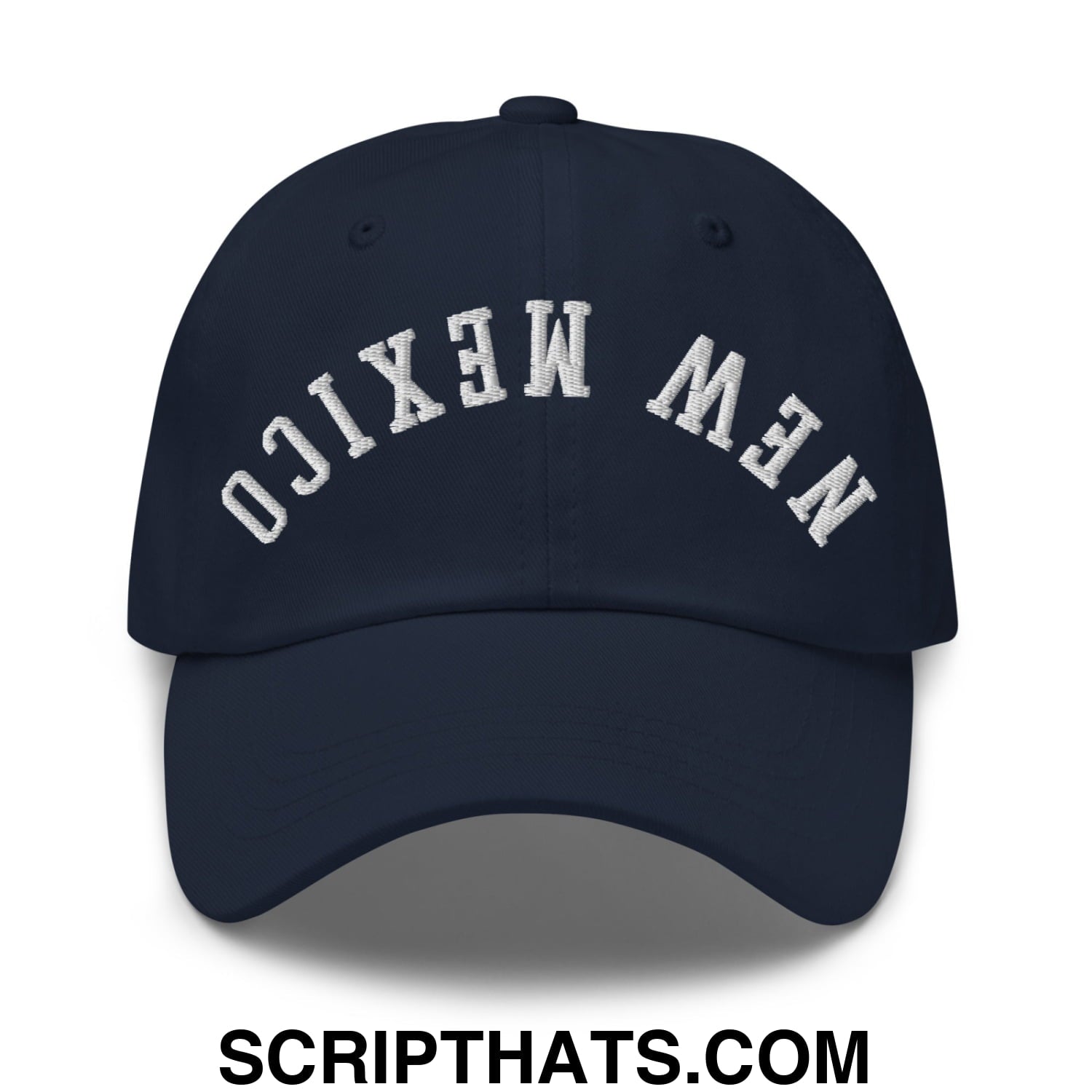 A navy blue unstructured dad hat with new mexico embroidered in white arched lettering on the front