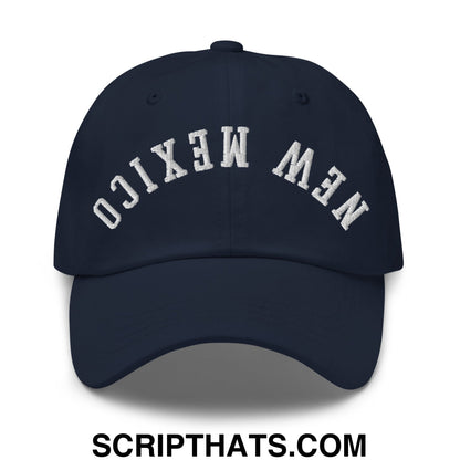 A navy blue unstructured dad hat with new mexico embroidered in white arched lettering on the front