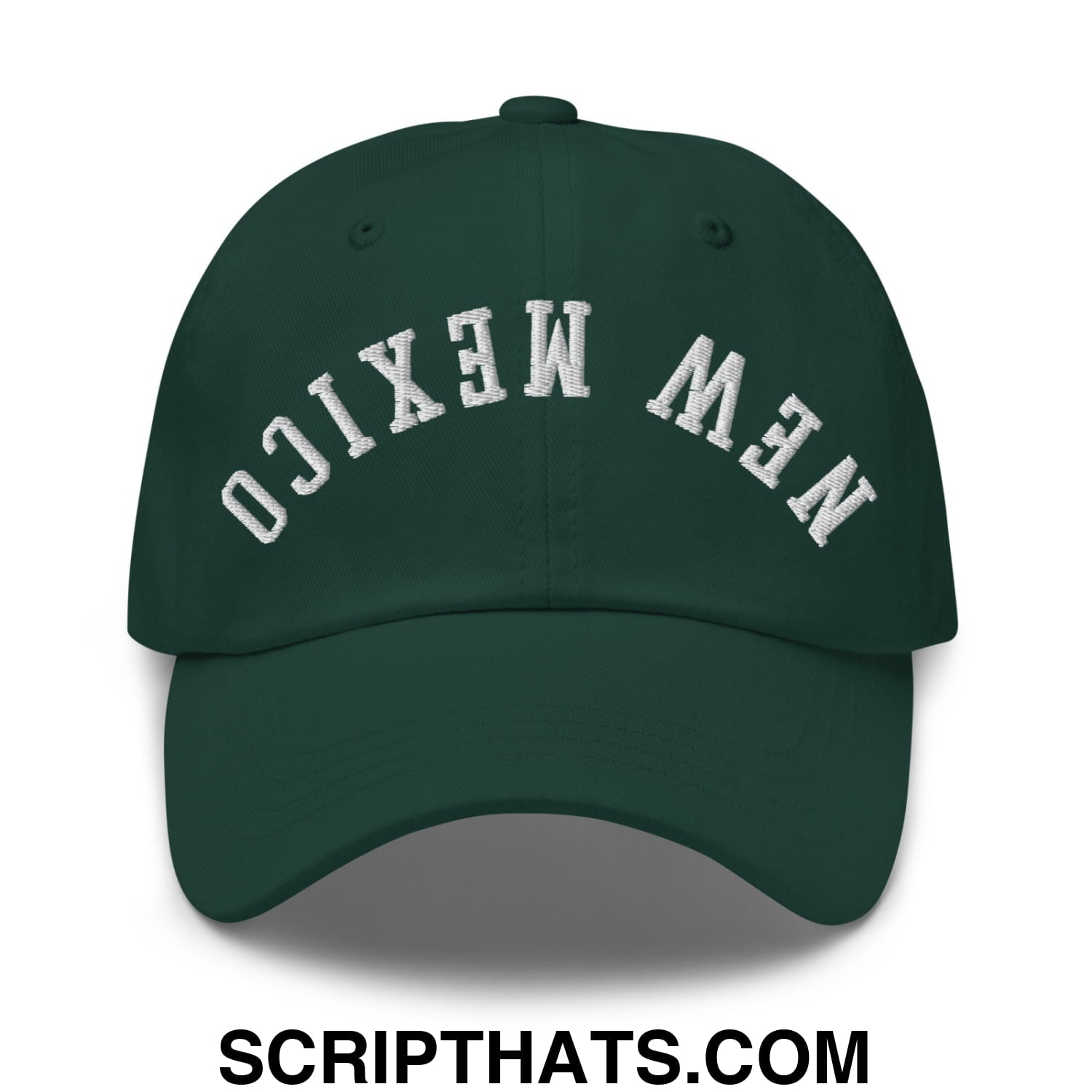 Dark green unstructured dad hat with white embroidered upside down new mexico lettering in an arched design