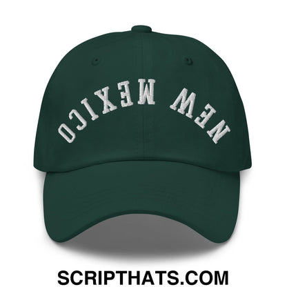 Dark green unstructured dad hat with white embroidered upside down new mexico lettering in an arched design