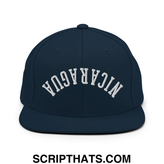 Navy blue snapback cap with white embroidered nicaragua arch design and flat bill brim for casual wear