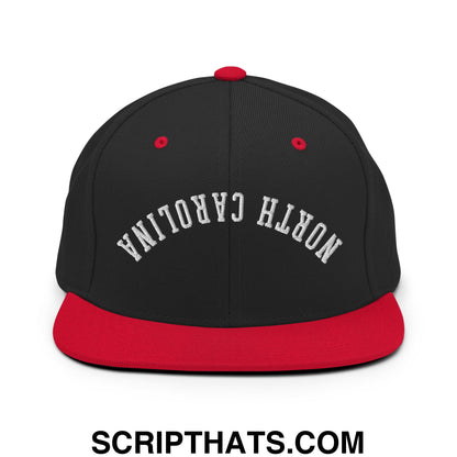 Black and red snapback hat with north carolina embroidered in white arched lettering on a flat bill brim