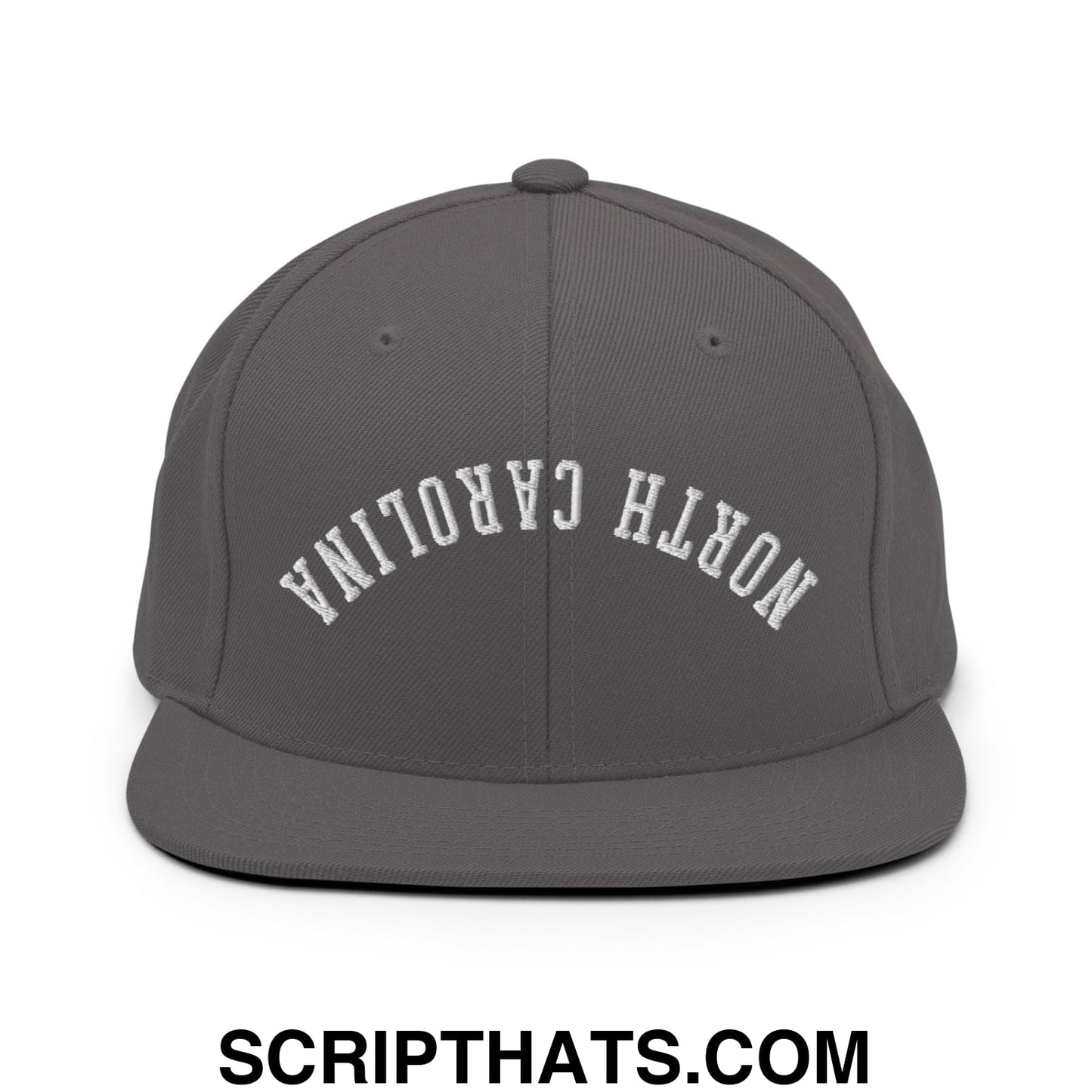 Dark gray snapback hat with white embroidered north carolina lettering and flat bill brim in an arched design