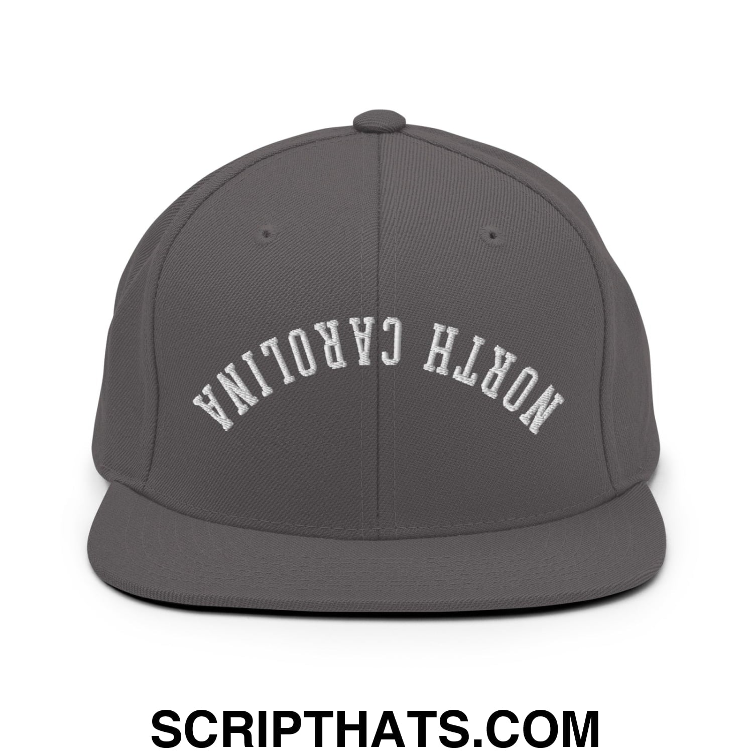 Dark gray snapback hat with white embroidered north carolina lettering and flat bill brim in an arched design