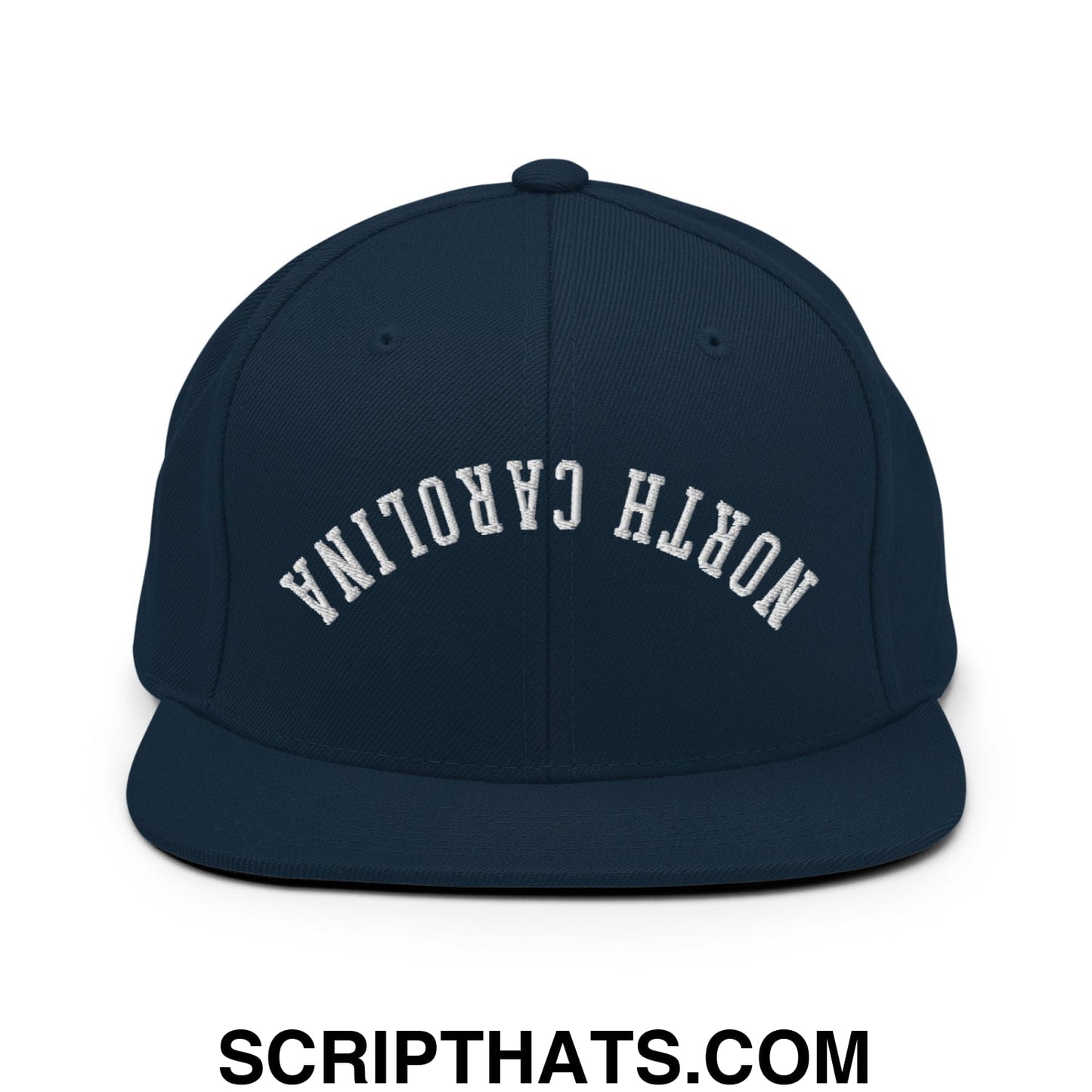 Navy blue snapback hat with white arched north carolina embroidery and flat bill brim in upside down style