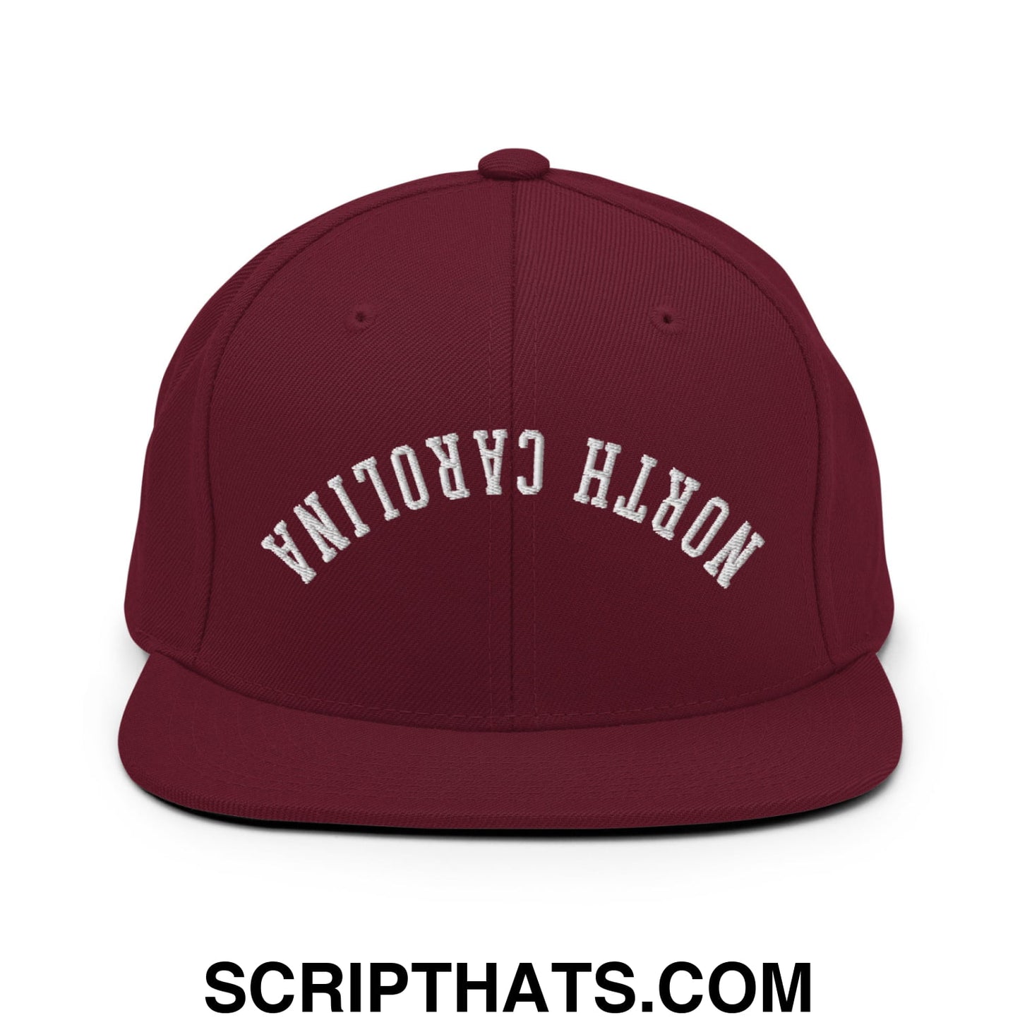 Maroon snapback hat with white embroidered north carolina text in an arched design and flat bill brim