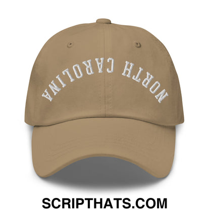 Beige unstructured dad hat with white embroidered north carolina arch on front in upside down design