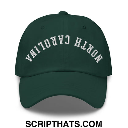 Dark green unstructured dad hat with white embroidered north carolina text in an arched design