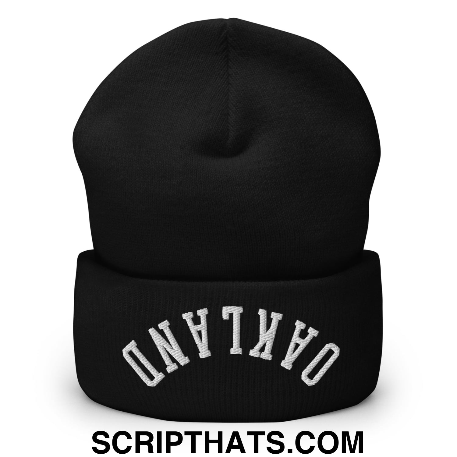 Black knit cuffed beanie with white arched oakland embroidery on folded cuff featuring upside down design