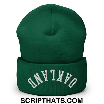 Deep green knit beanie with white embroidered oakland arch on the folded cuff called upside down oakland beanie