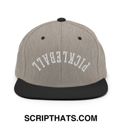 Gray and black flat bill brim snapback hat with white pickleball embroidered in arched lettering for sports use