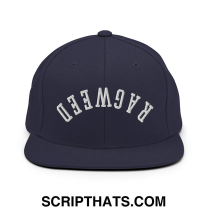 Navy blue snapback hat with white arched ragweed embroidery and flat bill brim in upside down style