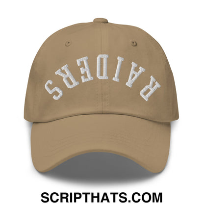 Tan unstructured dad hat with white embroidered raiders lettering in an arched design upside down style