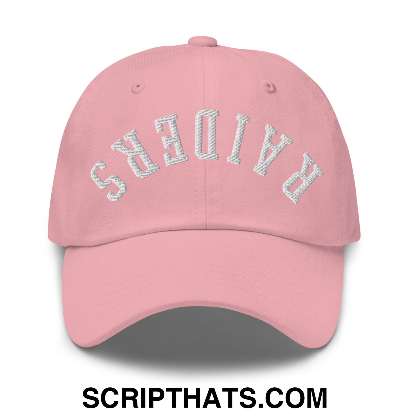 A soft pink upside down raiders embroidered unstructured dad hat with white curved thread design on the front