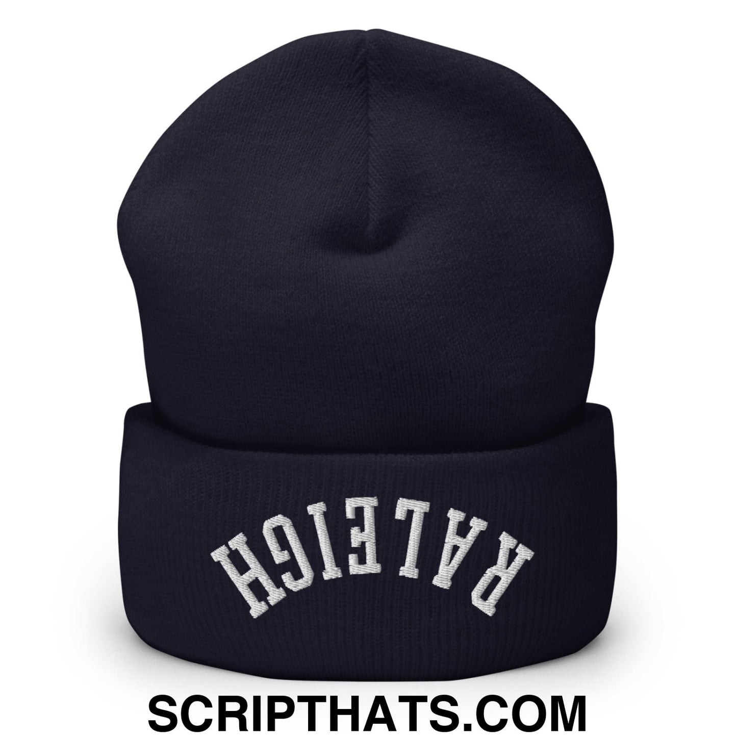 A navy blue knit beanie with a folded cuff and white arched raleigh embroidery on the front