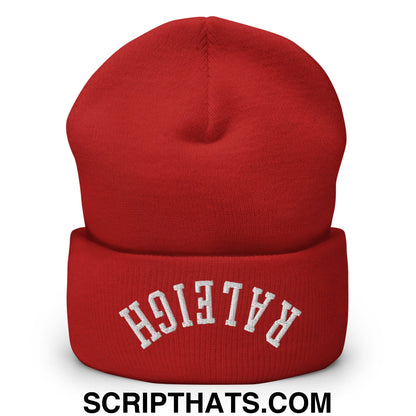 A vibrant red knit cuffed beanie with upside down raleigh embroidered in white arched lettering