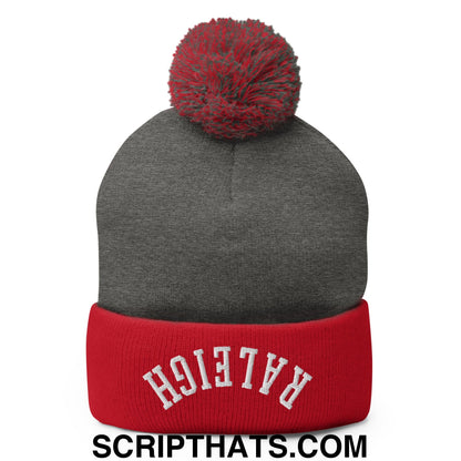 Gray and red knit pom pom beanie with raleigh embroidered in white on the cuff from upside down raleigh collection