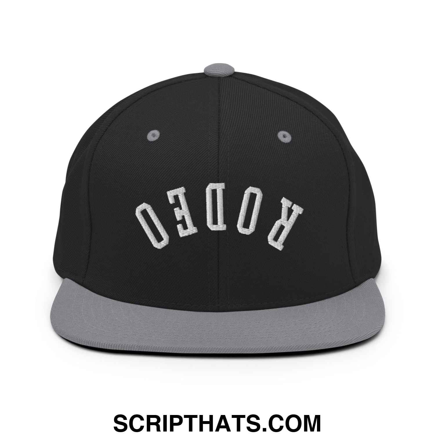 Black snapback hat with gray flat bill brim and white embroidered rodeo lettering in an arched design