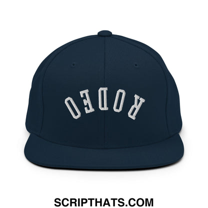 Navy blue snapback hat with white embroidered rodeo lettering and flat bill brim for casual wear