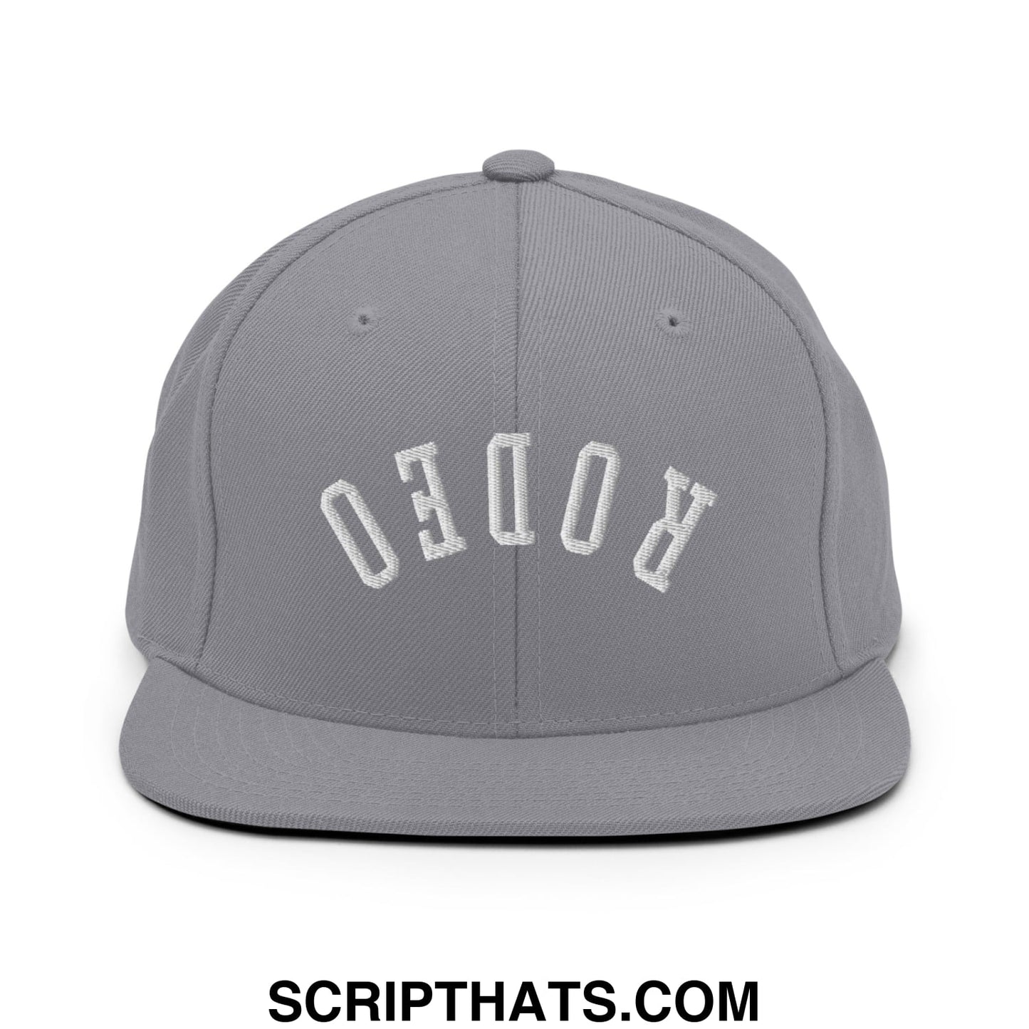 Gray snapback hat with white embroidered rodeo lettering in an arched design and flat bill brim