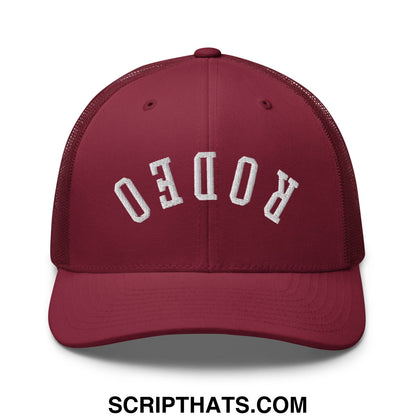 Maroon mesh trucker hat with white embroidered rodeo lettering titled upside down rodeo embroidered mesh trucker hat