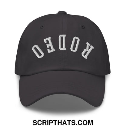Black unstructured dad hat with white embroidered rodeo lettering in an arched design Upside Down Rodeo hat