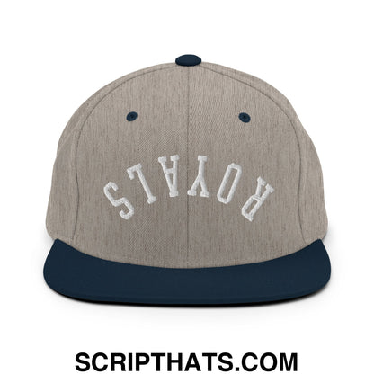 A gray and navy blue snapback hat with white royals embroidery and a flat bill brim