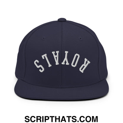 Navy blue snapback hat with white embroidered royals lettering in an arched design and flat bill brim