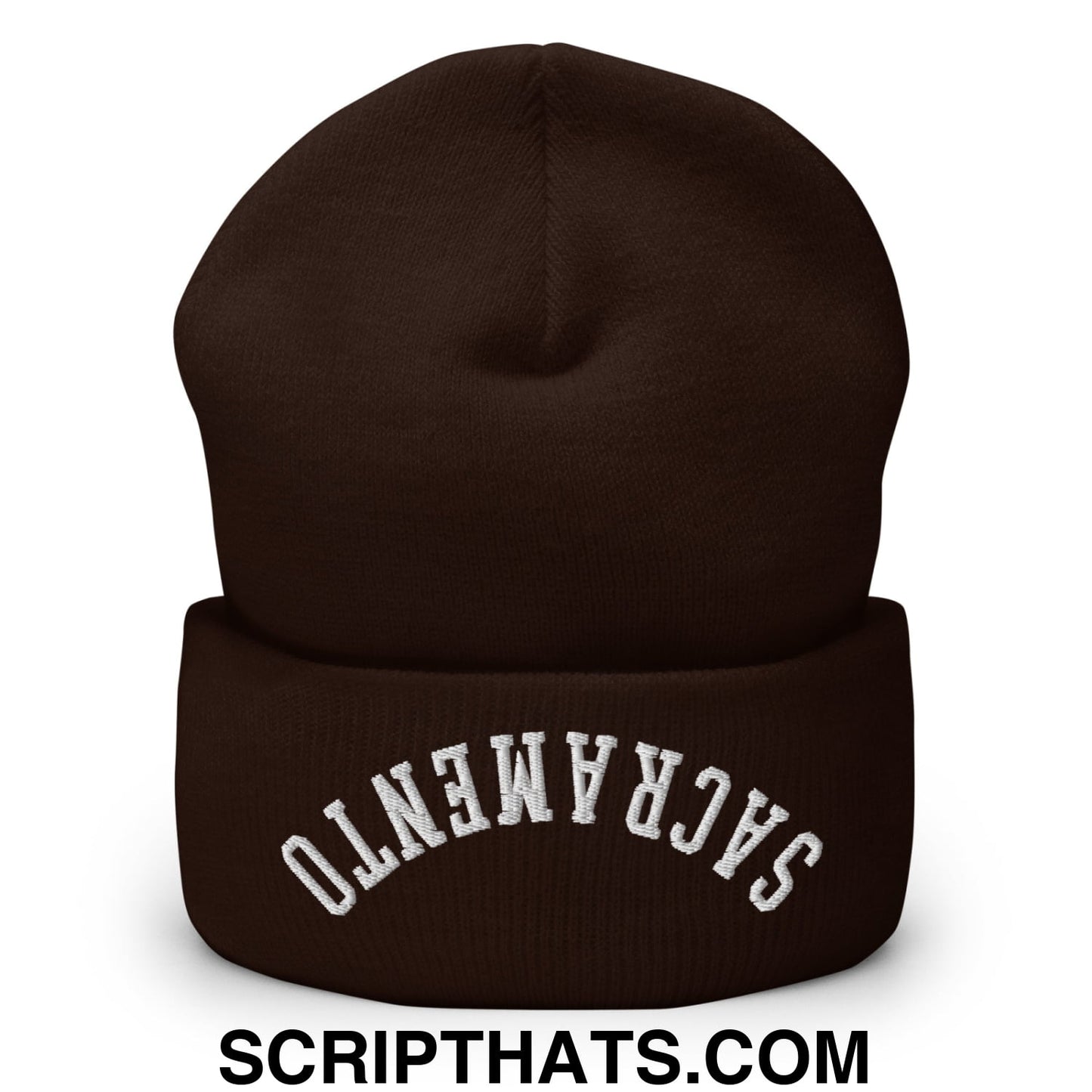 A dark brown knit beanie with white upside down sacramento embroidered on the folded cuff